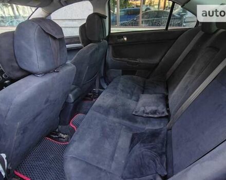 Черный Мицубиси Лансер, объемом двигателя 2 л и пробегом 240 тыс. км за 10000 $, фото 18 на Automoto.ua