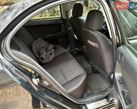 Черный Мицубиси Лансер, объемом двигателя 2 л и пробегом 260 тыс. км за 6100 $, фото 13 на Automoto.ua