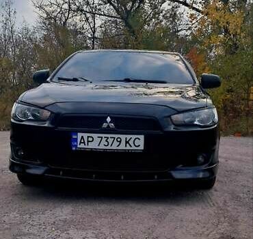 Черный Мицубиси Лансер, объемом двигателя 2 л и пробегом 211 тыс. км за 6900 $, фото 4 на Automoto.ua