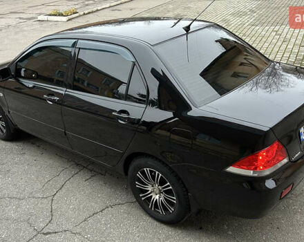 Чорний Міцубісі Lancer, об'ємом двигуна 1.58 л та пробігом 167 тис. км за 4800 $, фото 1 на Automoto.ua