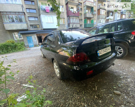 Чорний Міцубісі Lancer, об'ємом двигуна 1.6 л та пробігом 269 тис. км за 4500 $, фото 1 на Automoto.ua