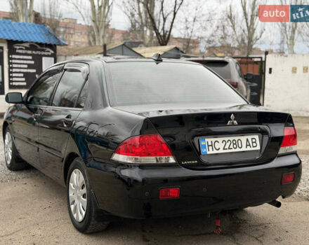 Черный Мицубиси Лансер, объемом двигателя 1.58 л и пробегом 249 тыс. км за 5499 $, фото 9 на Automoto.ua