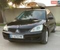 Черный Мицубиси Лансер, объемом двигателя 1.6 л и пробегом 292 тыс. км за 3950 $, фото 1 на Automoto.ua