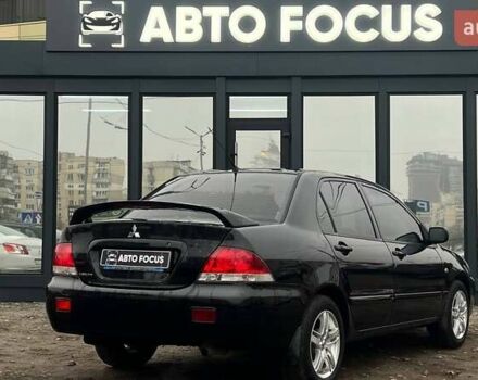 Чорний Міцубісі Lancer, об'ємом двигуна 1.6 л та пробігом 340 тис. км за 6190 $, фото 7 на Automoto.ua