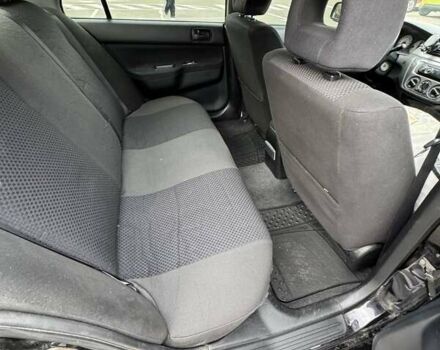 Чорний Міцубісі Lancer, об'ємом двигуна 1.6 л та пробігом 245 тис. км за 4500 $, фото 18 на Automoto.ua