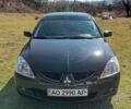 Черный Мицубиси Лансер, объемом двигателя 1.6 л и пробегом 2 тыс. км за 3200 $, фото 1 на Automoto.ua