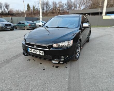 Черный Мицубиси Лансер, объемом двигателя 2 л и пробегом 245 тыс. км за 5600 $, фото 4 на Automoto.ua