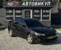 Черный Мицубиси Лансер, объемом двигателя 2 л и пробегом 205 тыс. км за 6583 $, фото 1 на Automoto.ua