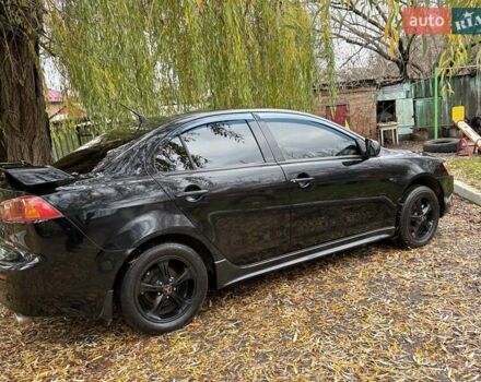 Черный Мицубиси Лансер, объемом двигателя 2 л и пробегом 260 тыс. км за 6100 $, фото 9 на Automoto.ua