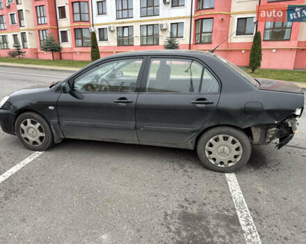 Чорний Міцубісі Lancer, об'ємом двигуна 1.58 л та пробігом 388 тис. км за 2300 $, фото 7 на Automoto.ua