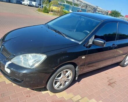 Черный Мицубиси Лансер, объемом двигателя 1.6 л и пробегом 409 тыс. км за 3000 $, фото 2 на Automoto.ua