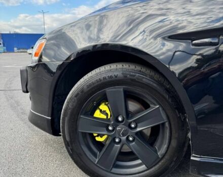 Черный Мицубиси Лансер, объемом двигателя 2 л и пробегом 297 тыс. км за 7500 $, фото 7 на Automoto.ua