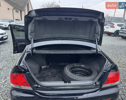 Черный Мицубиси Лансер, объемом двигателя 1.58 л и пробегом 202 тыс. км за 4100 $, фото 28 на Automoto.ua