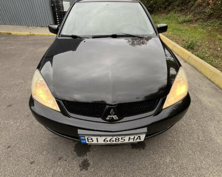 Чорний Міцубісі Lancer, об'ємом двигуна 1.58 л та пробігом 192 тис. км за 4500 $, фото 10 на Automoto.ua