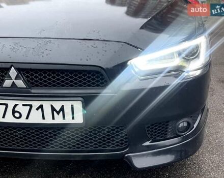 Черный Мицубиси Лансер, объемом двигателя 2 л и пробегом 217 тыс. км за 7000 $, фото 40 на Automoto.ua