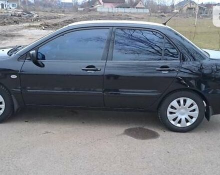 Чорний Міцубісі Lancer, об'ємом двигуна 1.6 л та пробігом 131 тис. км за 6000 $, фото 6 на Automoto.ua