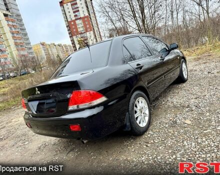 Черный Мицубиси Лансер, объемом двигателя 1.6 л и пробегом 216 тыс. км за 5190 $, фото 4 на Automoto.ua
