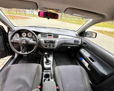 Черный Мицубиси Лансер, объемом двигателя 1.6 л и пробегом 185 тыс. км за 5500 $, фото 7 на Automoto.ua