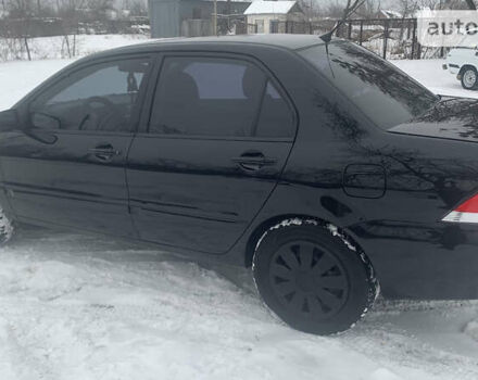 Чорний Міцубісі Lancer, об'ємом двигуна 1.58 л та пробігом 212 тис. км за 4799 $, фото 8 на Automoto.ua