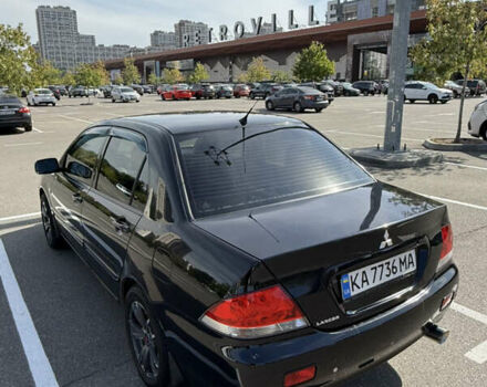 Черный Мицубиси Лансер, объемом двигателя 1.6 л и пробегом 321 тыс. км за 5000 $, фото 7 на Automoto.ua