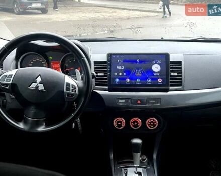 Черный Мицубиси Лансер, объемом двигателя 2 л и пробегом 217 тыс. км за 7000 $, фото 3 на Automoto.ua