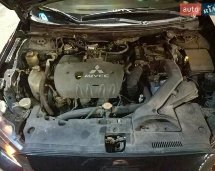 Черный Мицубиси Лансер, объемом двигателя 2 л и пробегом 240 тыс. км за 6400 $, фото 21 на Automoto.ua