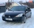 Черный Мицубиси Лансер, объемом двигателя 1.58 л и пробегом 220 тыс. км за 3950 $, фото 1 на Automoto.ua
