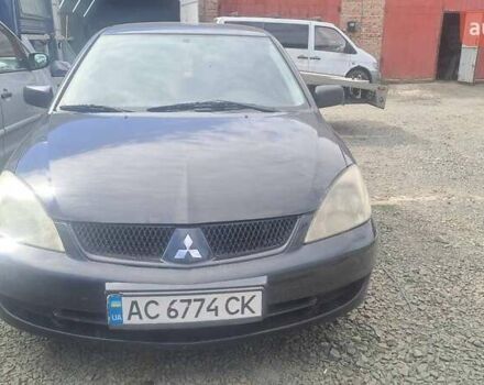 Черный Мицубиси Лансер, объемом двигателя 1.58 л и пробегом 316 тыс. км за 2200 $, фото 1 на Automoto.ua