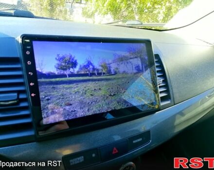 Черный Мицубиси Лансер, объемом двигателя 2 л и пробегом 196 тыс. км за 5500 $, фото 8 на Automoto.ua