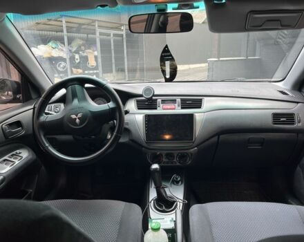 Черный Мицубиси Лансер, объемом двигателя 1.6 л и пробегом 168 тыс. км за 5662 $, фото 2 на Automoto.ua