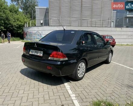 Чорний Міцубісі Lancer, об'ємом двигуна 1.6 л та пробігом 296 тис. км за 4200 $, фото 4 на Automoto.ua