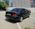 Чорний Міцубісі Lancer, об'ємом двигуна 1.6 л та пробігом 296 тис. км за 4200 $, фото 4 на Automoto.ua