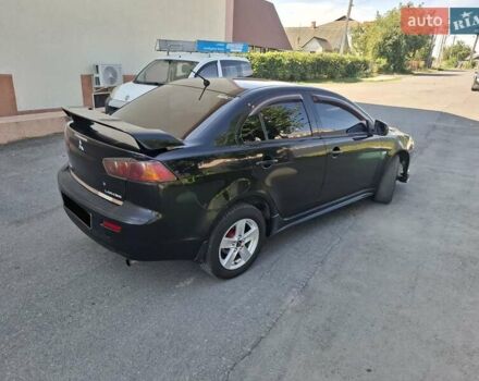 Черный Мицубиси Лансер, объемом двигателя 2 л и пробегом 230 тыс. км за 7000 $, фото 17 на Automoto.ua