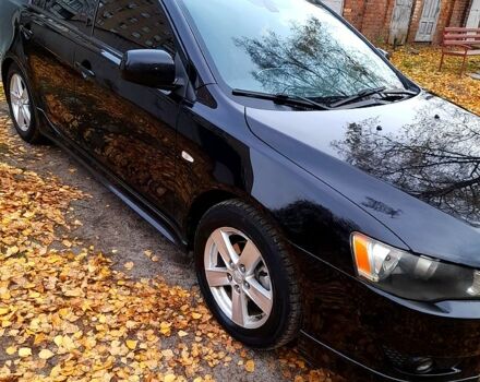 Черный Мицубиси Лансер, объемом двигателя 2 л и пробегом 260 тыс. км за 7000 $, фото 2 на Automoto.ua