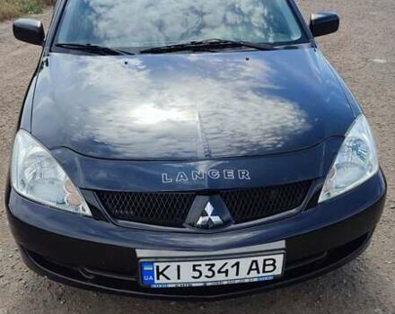 Черный Мицубиси Лансер, объемом двигателя 1.6 л и пробегом 243 тыс. км за 4500 $, фото 1 на Automoto.ua