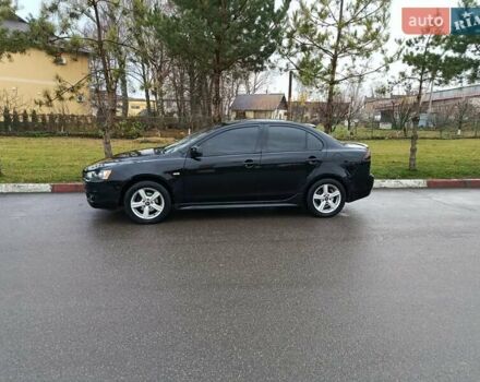 Черный Мицубиси Лансер, объемом двигателя 2 л и пробегом 200 тыс. км за 5100 $, фото 2 на Automoto.ua