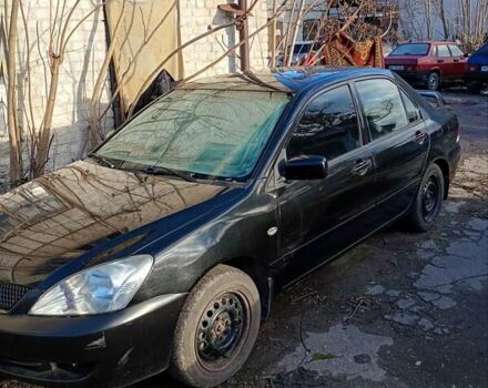 Черный Мицубиси Лансер, объемом двигателя 1.6 л и пробегом 140 тыс. км за 2500 $, фото 2 на Automoto.ua