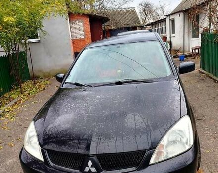 Черный Мицубиси Лансер, объемом двигателя 1.6 л и пробегом 126 тыс. км за 4500 $, фото 2 на Automoto.ua
