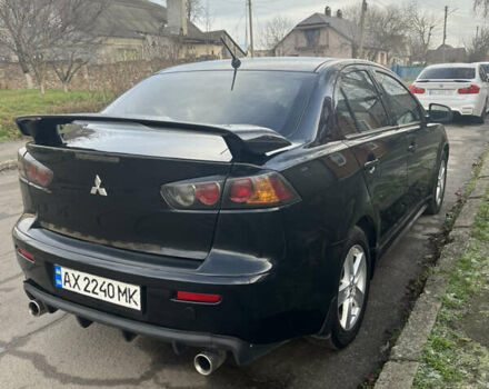 Черный Мицубиси Лансер, объемом двигателя 2 л и пробегом 270 тыс. км за 5400 $, фото 3 на Automoto.ua