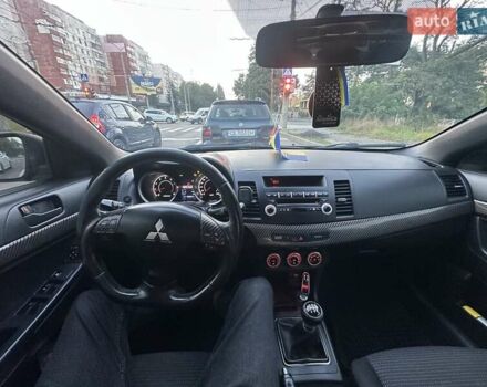 Черный Мицубиси Лансер, объемом двигателя 2 л и пробегом 188 тыс. км за 6900 $, фото 7 на Automoto.ua