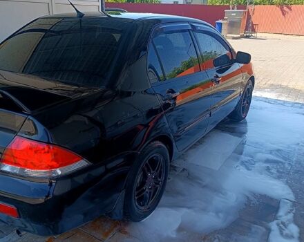 Чорний Міцубісі Lancer, об'ємом двигуна 1.6 л та пробігом 0 тис. км за 4200 $, фото 7 на Automoto.ua