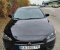 Черный Мицубиси Лансер, объемом двигателя 2 л и пробегом 227 тыс. км за 6000 $, фото 1 на Automoto.ua