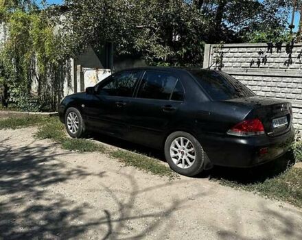 Чорний Міцубісі Lancer, об'ємом двигуна 1.6 л та пробігом 294 тис. км за 6500 $, фото 5 на Automoto.ua