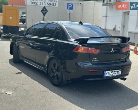 Черный Мицубиси Лансер, объемом двигателя 2 л и пробегом 295 тыс. км за 7000 $, фото 5 на Automoto.ua