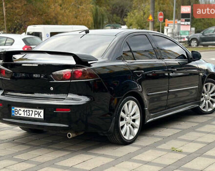 Черный Мицубиси Лансер, объемом двигателя 2 л и пробегом 236 тыс. км за 7950 $, фото 3 на Automoto.ua