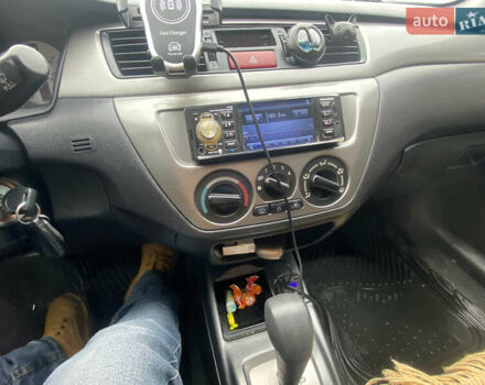 Черный Мицубиси Лансер, объемом двигателя 1.58 л и пробегом 211 тыс. км за 6333 $, фото 40 на Automoto.ua