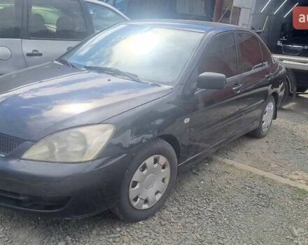 Черный Мицубиси Лансер, объемом двигателя 1.58 л и пробегом 316 тыс. км за 2200 $, фото 2 на Automoto.ua