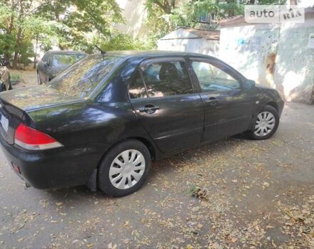 Чорний Міцубісі Lancer, об'ємом двигуна 1.6 л та пробігом 335 тис. км за 3100 $, фото 11 на Automoto.ua