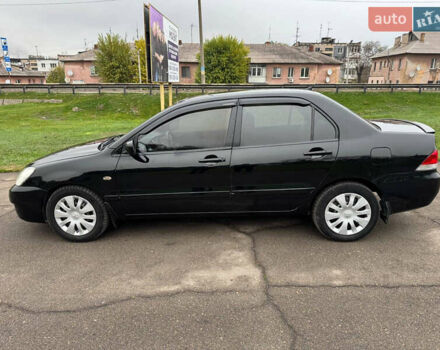 Чорний Міцубісі Lancer, об'ємом двигуна 1.6 л та пробігом 200 тис. км за 4500 $, фото 7 на Automoto.ua