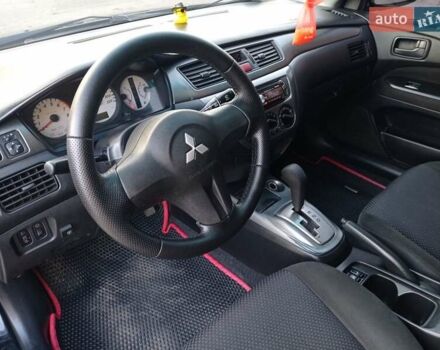 Чорний Міцубісі Lancer, об'ємом двигуна 1.58 л та пробігом 286 тис. км за 4950 $, фото 5 на Automoto.ua